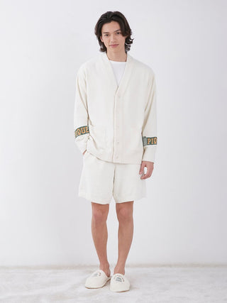 Model wearing Air Moco Sleepy Bear Lounge Shorts, showcasing cozy hotel-themed loungewear with whimsical bear motif.