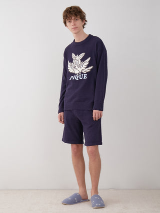 Model wearing KOUSUKE SHIMIZU Men's Air Moco Lounge Shorts in deep navy, showcasing relaxed style and luxurious comfort.
