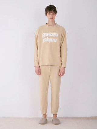 Model wearing MENS Air Moco Logo Jacquard Lounge Pants in beige, with matching top by Gelato Pique, showcasing relaxed fit comfort.
