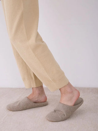 Side view of Gelato Pique MENS Air Moco Lounge Pants with slippers, highlighting comfort and relaxed fit.