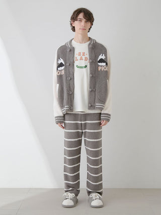 Model wearing Mens Powder Border Lounge Pants in gray with stripes, paired with a graphic sweater, showcasing relaxed, comfortable style.