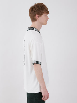 Side view of model wearing Smoothie Lite Tennis Logo Lounge Shirt, showcasing sporty chic design and retro-inspired comfort.