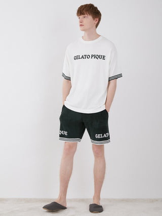 Man wearing Gelato Pique Smoothie Lite Tennis Logo Lounge Top and shorts set.