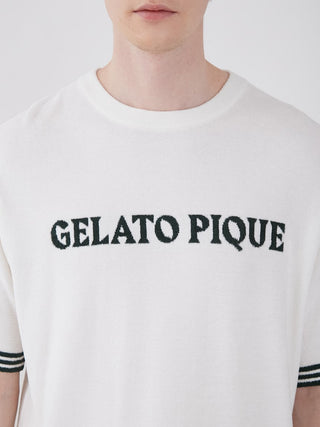 Man wearing Smoothie Lite Tennis Logo Lounge Top with Gelato Pique branding, retro-inspired design in white fabric.