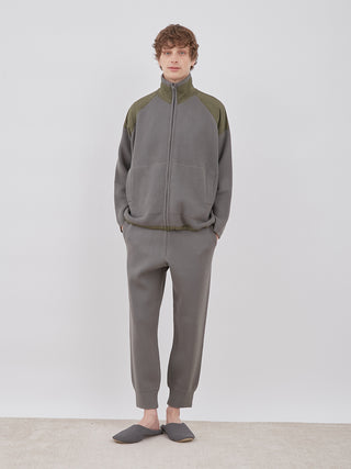 Model wearing OCEANS Plating Moco ECWCS Blouson Jacket in gray by Gelato Pique, full front view.