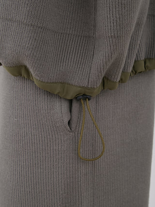 Detail of the OCEANS Plating Moco ECWCS Blouson Jacket showcasing the ribbed knit fabric and drawstring detail for enhanced comfort.