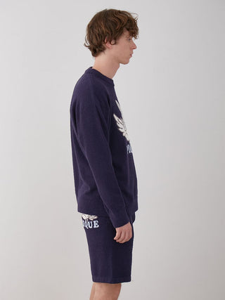 Man wearing KOUSUKE SHIMIZU Men's Air Moco Pullover Sweater in navy side view