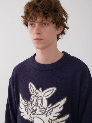 Model wearing KOUSUKE SHIMIZU Men's Navy Air Moco Pullover Sweater with rabbit graphic, showcasing cozy elegance.