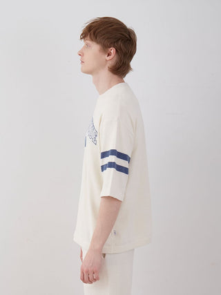 Model wearing Men's Air Moco College Drop Shoulder Lounge T-Shirt side view, showcasing casual style and breathable fabric.