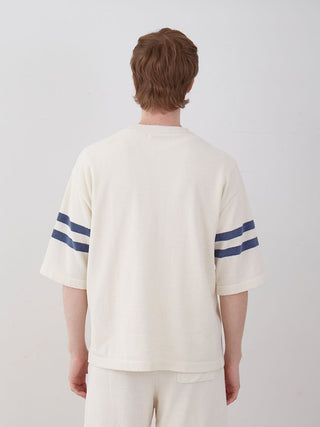 Back view of Men's Air Moco College Drop Shoulder Lounge T-Shirt in white with blue stripes, showcasing its relaxed fit and style.