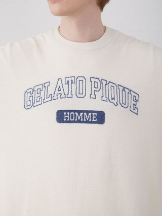 Person wearing Gelato Pique Homme drop shoulder lounge t-shirt in cream color.