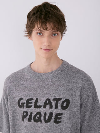 Model wearing Gelato Pique Men's Melange Knit Shirt with logo, heathered texture and relaxed fit.