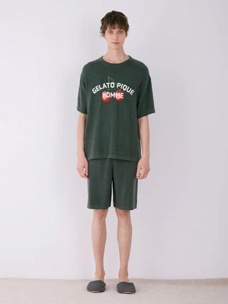 Man wearing Gelato Pique Smoothie Cherry Fleece Shirt and shorts, showcasing embroidered cherry design and casual loungewear style.