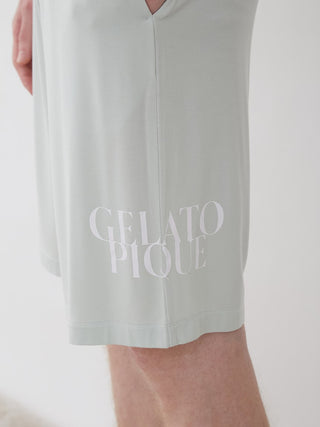 Men's COOL Rayon Comfy Lounge Shorts showcasing logo detail, crafted from lightweight, breathable fabric for stylish comfort in hot weather.