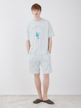 Model wearing Men's Cream Soda Lounge Shorts by Gelato Pique in light blue, featuring a playful cream soda pattern for ultimate relaxation.