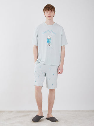 Model wearing Men's Cream Soda Lounge Shorts by Gelato Pique, featuring a playful cream soda print in light blue for ultimate relaxation.