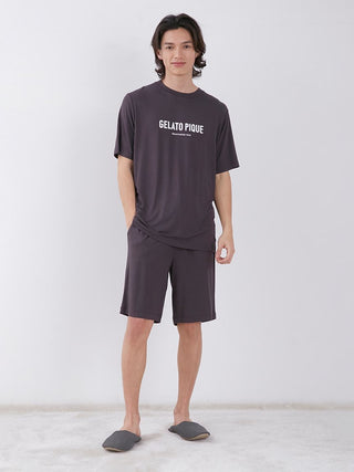 Model wearing MEN'S Rayon Logo Sleepwear T-shirt in dark color, showcasing eco-friendly fabric and comfortable fit.