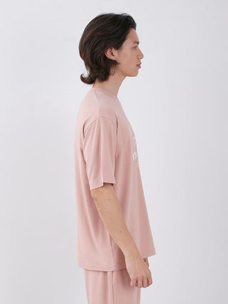 Model wearing Sarafree Logo Men's Loungewear Set in pink, showcasing style and comfort with UV protection and quick-drying material.
