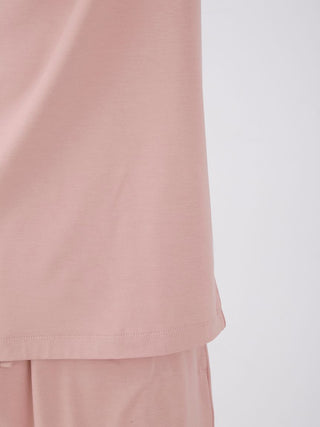 Close-up of Sarafree Logo Men's Loungewear Set in soft pink, featuring lightweight, quick-drying fabric for summer comfort.