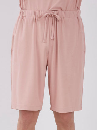 Men's loungewear shorts in light pink with drawstring, Sarafree Logo, offering UV protection and quick-drying features for comfort.