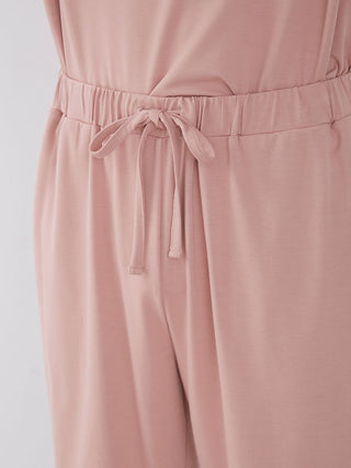 Close-up of Sarafree Logo Men's Loungewear Set in light pink, showcasing soft fabric and drawstring waist for comfort.