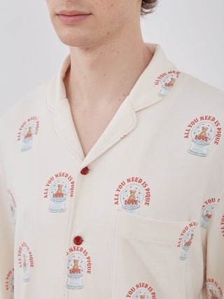 Close-up of long sleeve sleep shirt featuring snow globe teddy bear pattern.