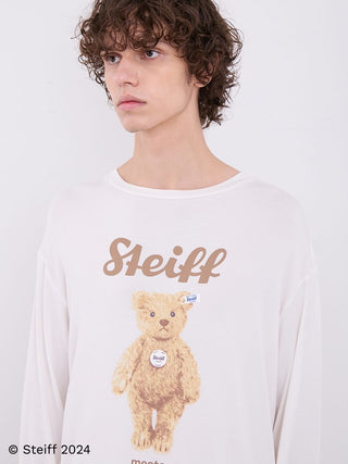 Model wearing Steiff Men's James Long Sleeve Top with teddy bear motif, soft ivory color, showcasing comfortable and polished style