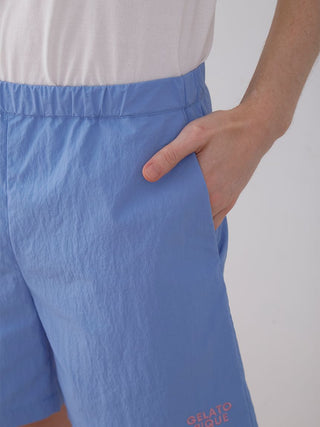 Blue nylon lounge shorts by Gelato Pique USA showcasing lightweight fabric and side pocket, perfect for summer comfort and style.