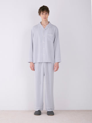 Men's satin shirt and pants set in light gray, featuring button-down design and notch collar, ideal for luxurious loungewear.
