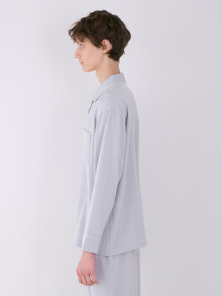 Model wearing MEN'S Satin Shirt in light gray, showcasing side profile with notch collar and chest pocket, highlighting luxurious loungewear design.