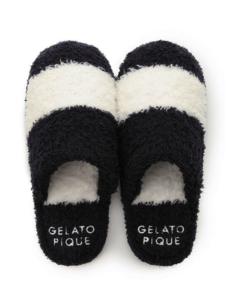 Black and white striped Gelato Border house slippers with soft, fluffy texture.