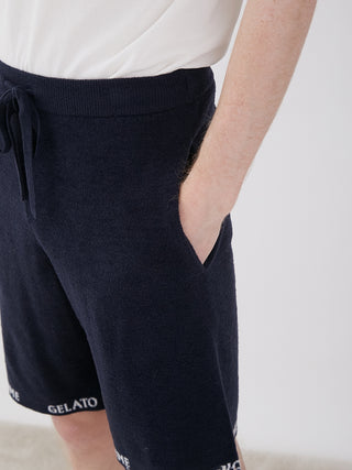 Person wearing Men's Smoothie Light Comfy Lounge Shorts, showcasing soft material and deep pockets for ultimate comfort and style.