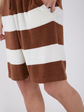 Close-up of brown and white striped loungewear shorts made from lightweight fabric, featuring a smooth texture and comfortable fit.
