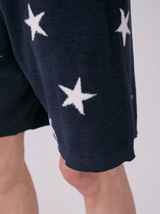 Close-up of men's Air Mocostar Jacquard Lounge Shorts featuring star pattern on lightweight fabric for comfort and style.