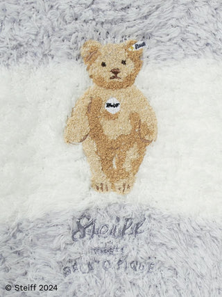 Plush Steiff teddy bear design on fuzzy pajama fabric, featuring Gelato Pique's signature soft-knit in neutral tones.