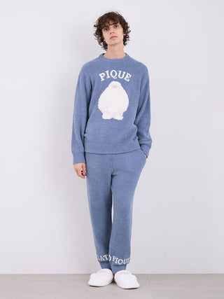 Model wearing blue Gelato Pique Powder Logo Pajama Pants and matching top, showcasing ultra-soft fabric with logo at cuffs.