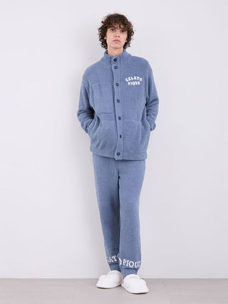 Model wearing Gelato Pique Powder Logo Pajama Pants and matching top in cozy "Gelato" fabric, showcasing signature logo at cuffs.