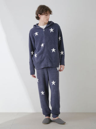 Man wearing Powder Star Jacquard Lounge Pants and hoodie from Gelato Pique USA in star pattern, showcasing cozy loungewear style.