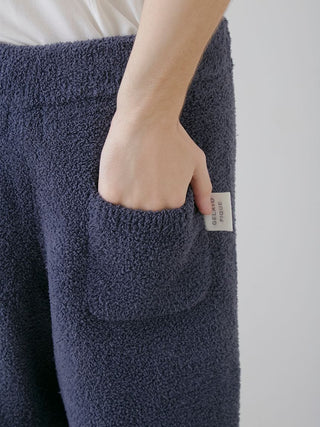 Close-up of navy powder knit lounge pants with a pocket, showcasing the soft texture and modern design by Gelato Pique USA.