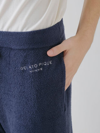 Close-up of navy Gelato Pique lounge pants with pocket detail, showcasing soft Smoothie fabric and embroidered logo for casual comfort.