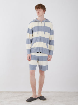 Model wearing the Smoothie Lite 2 Stripe Loungewear Hoodie and shorts set with elegant border pattern in a relaxed pose.