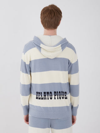 Man wearing Smoothie Lite 2 Stripe Loungewear Hoodie with back graphic, blue and cream border pattern, showcasing casual style.