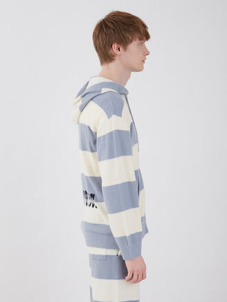Side view of a model wearing a Smoothie Lite 2 Border Loungewear Hoodie in blue and white stripes with back logo, showcasing comfort and style.
