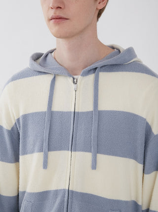 Person wearing Smoothie Lite 2 Border Loungewear Hoodie in grey and cream stripes, showcasing cozy and elegant style.
