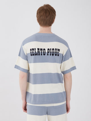 Back view of a man wearing a blue and white striped Smoothie Lite 2 Border short sleeve sweatshirt, featuring 'Gelato Pique' text.