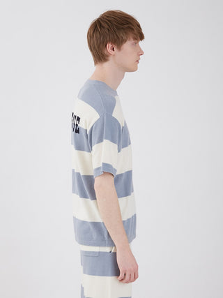 Side view of a man wearing a striped Smoothie Lite 2 Border Men's Short Sleeve Sweatshirt in blue and white, showcasing comfortable summer style.