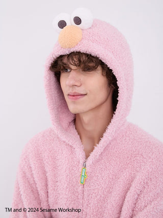Man wearing Sesame Street Elmo hoodie, part of a loungewear set made from fluffy fabric by Gelato Pique, featuring cozy design elements.