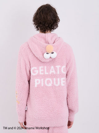 Back view of Elmo-themed men's loungewear from Gelato Pique featuring a fluffy pink hoodie with playful character details.