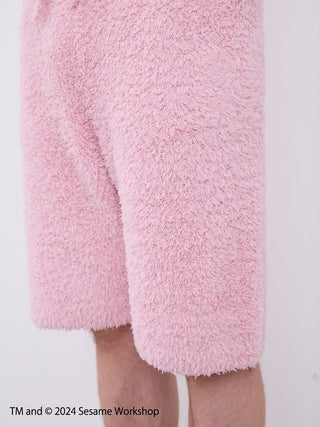 Close-up of fluffy pink shorts from the 【SESAME STREET】 MEN's Elmo Hoodie and Shorts Loungewear Set, showcasing soft fabric detail.