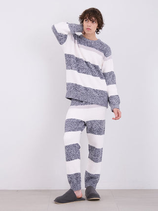 Man wearing a mens powder melange border fuzzy pullover sweater with matching pants, showcasing cozy and sophisticated loungewear.